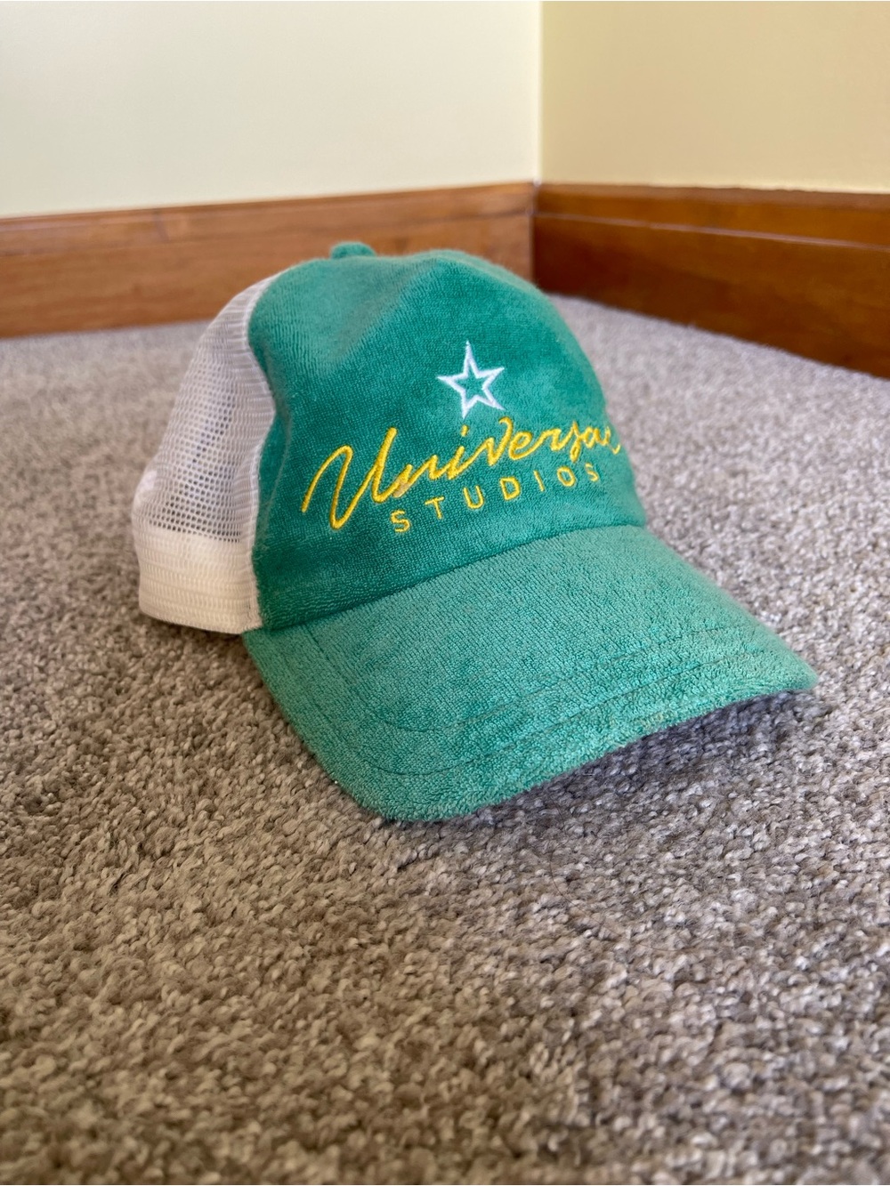 Universal Green and White Mesh Trucker Hat with Yellow Embroidery